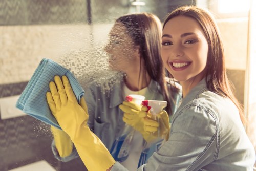 Local team carrying out exterior façade cleaning on a mixed-use property